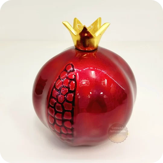 Red pomegranate figurine from Jerusalem